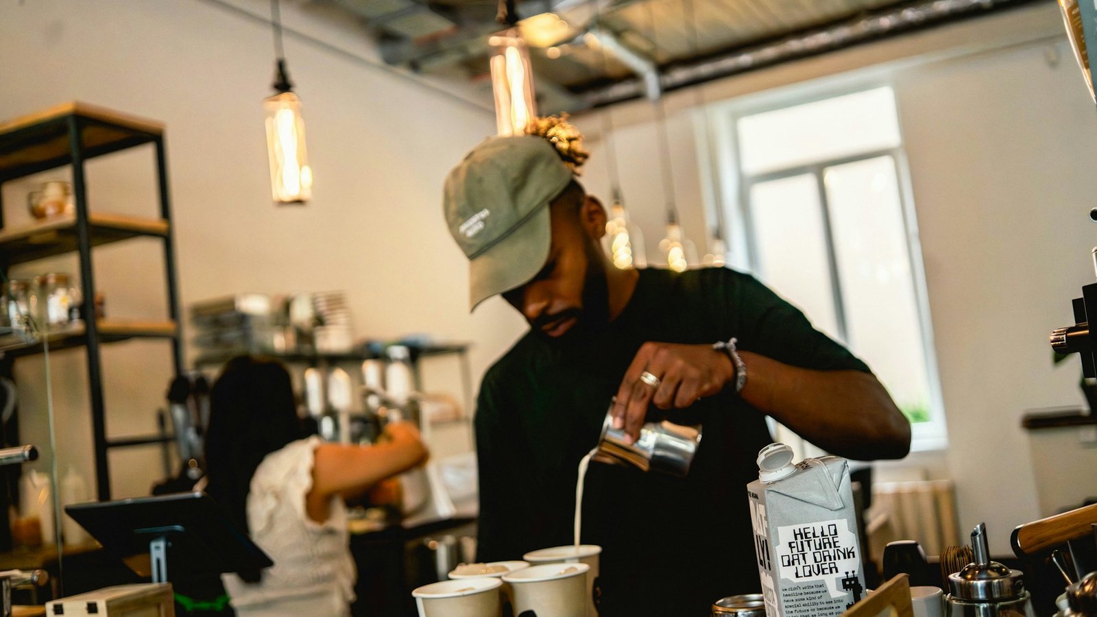 Barista preparing coffee in a modern cafe
