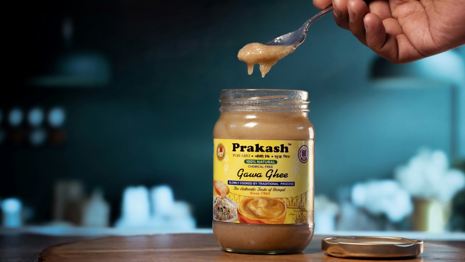 Can You Really Test Ghee Purity at Home? What FSSAI Tests Actually Tell You Jar of ghee being spooned, illustrating common home observations about ghee