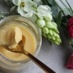 Jar of ghee with a spoon, illustrating a guide to ghee purity testing