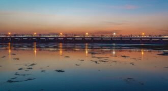 Durgapur Barrage and the river beneath a colourful evening sky