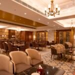 Modern restaurant dining interior with tables and upholstered seating
