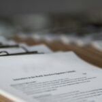 Printed restaurant menus on wooden clipboards, photographed in close-up