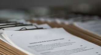 Printed restaurant menus on wooden clipboards, photographed in close-up
