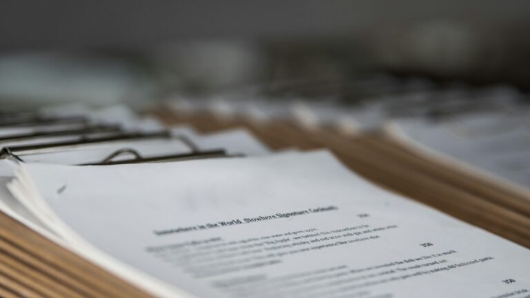 Printed restaurant menus on wooden clipboards, photographed in close-up